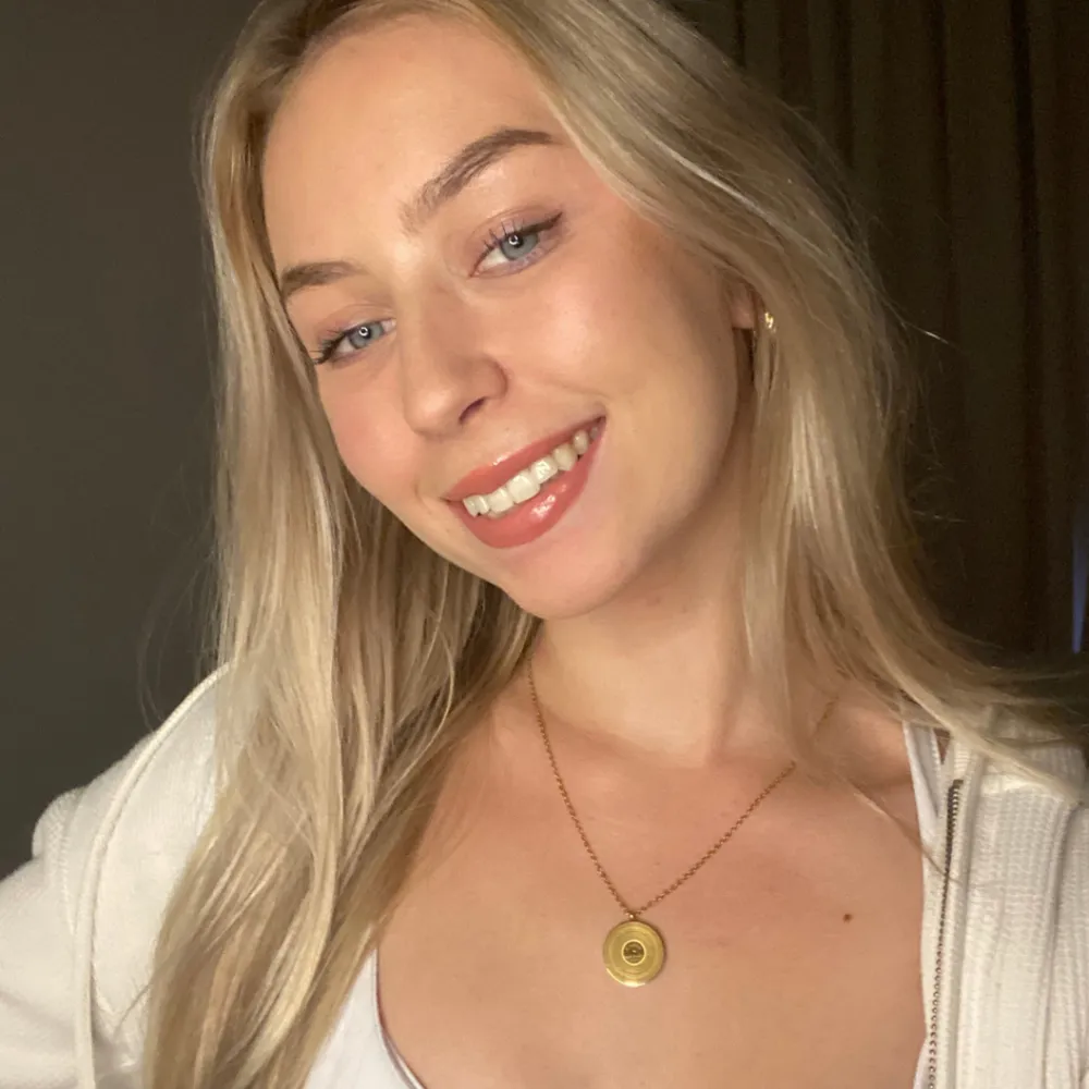 gold Adele Someone Like You lyric necklace worn by woman